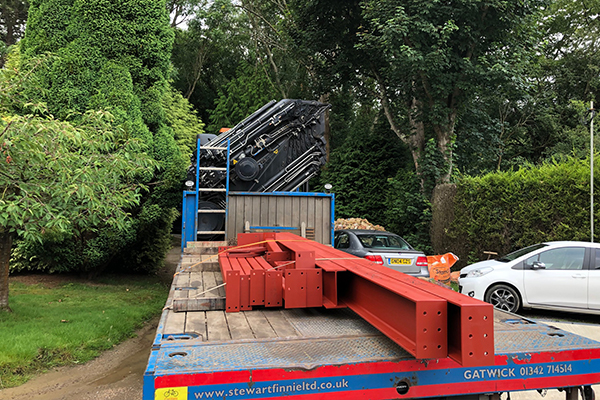 An image of some metal I beams we created being transported on the back of a truck