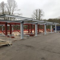 An image showing some metal I beams we fabricated now being used to create a building