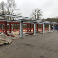 An image showing some metal I beams we fabricated now being used to create a building