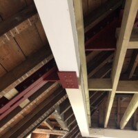 An image of some metal I beams we fabricated being used in a building