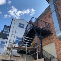 An image of a metal fire escape staircase we fabricated